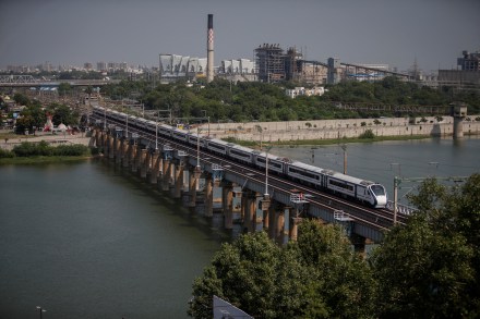 India's high-speed train 'Vande Bharat Express' passes a railway bridge after being inaugurated by Prime Minister Narendra Modi, in Ahmedabad India's high-speed train 'Vande Bharat Express' passes a railway bridge after being inaugurated by Prime Minister Narendra Modi, in Ahmedabad
