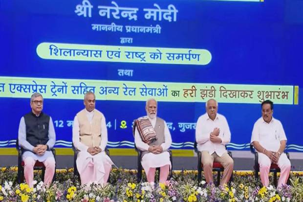 Prime Minister Narendra Modi with Gujarat Governor Acharya Devvrat and Chief Minister Bhupendra Patel, Union Minister Ashwini Vaishnaw and other during the inauguration, dedication and foundation stone laying of various projects, in Ahmedabad (PTI Photo)