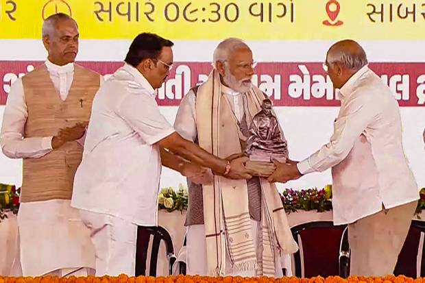 Prime Minister Narendra Modi being felicitated by Gujarat Chief Minister Bhupendra Patel during the launch of master plan for Sabarmati Ashram project, in Gujarat's Ahmedabad. (PTI Photo)