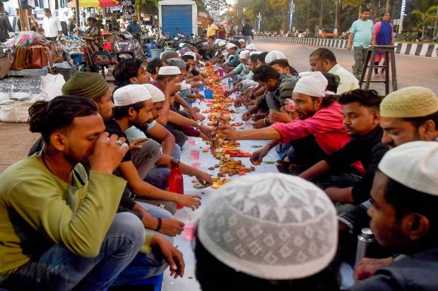 Muslim devotees have 'iftar' meal together to break their fast during the holy month of Ramadan, in Mumbai.. (PTI Photo)