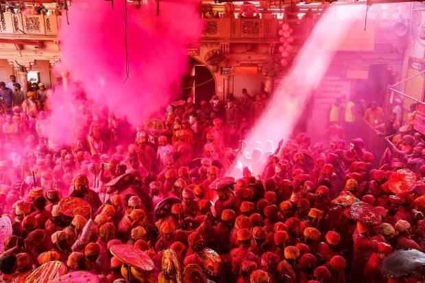 Devotees during Latthamaar Holi celebration at Sri Ji temple at Barsana near Mathura. (PTI Photo)