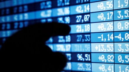 A man points at a computer screen showing stock information (Image/Reuters) A man points at a computer screen showing stock information (Image/Reuters)