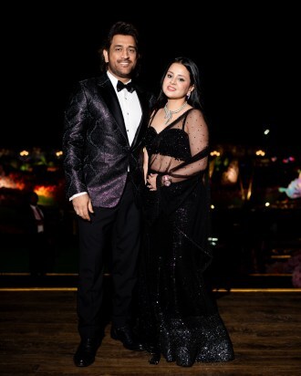 Cricketer Mahendra Singh Dhoni, along with his wife, was seen posing for photographs at Anant Ambani and Radhika Merchant's pre-wedding celebrations on Day 1. (Photo Credit: PR Handout)