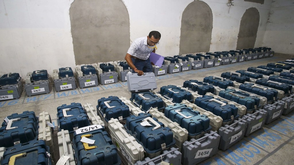 A polling official checks Electronic Voting Machines (EVM) kept inside a strong room ahead of the first phase of voting for Lok Sabha elections, in Agartala, Thursday, April 18, 2024. (PTI Photo)