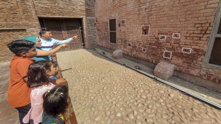Visitors look at a wall with bullet marks during their visit to the Jallianwala Bagh Martyrs' Memorial on the eve of the Jallianwala Bagh massacre anniversary, in Amritsar, Friday, April 12, 2024. (PTI Photo) Visitors look at a wall with bullet marks during their visit to the Jallianwala Bagh Martyrs' Memorial on the eve of the Jallianwala Bagh massacre anniversary, in Amritsar, Friday, April 12, 2024. (PTI Photo)