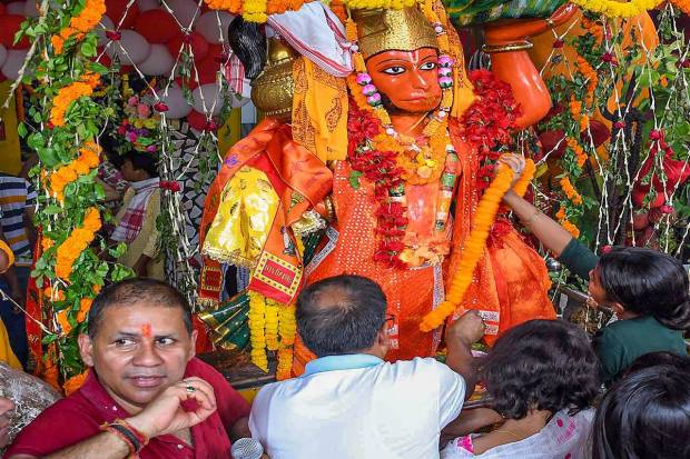 Devotees offer prayers on the occasion of 'Hanuman Jayanti' festival at a Lord Hanuman temple, in Ganeshguri, Guwahati. (PTI Photo)