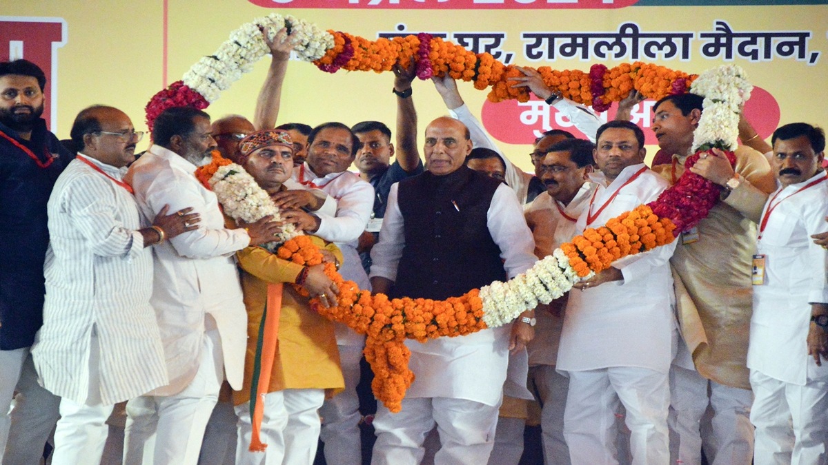 Defence Minister Rajnath Singh being garlanded by BJP workers during a public meeting in support of BJP candidate Atul Garg ahead of upcoming Lok Sabha elections, in Ghaziabad, Wednesday, April 3, 2024. (PTI Photo)