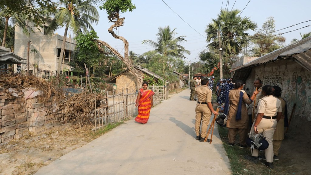 Villagers celebrating the arrest of SK Shajahan near Sandeshkhali ferry ghat. Express photo.