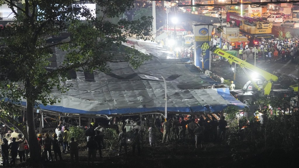 Rescue work underway after a huge billboard collapsed on a petrol pump due to strong winds and rain, at Ghatkopar in Mumbai, Monday, May 13, 2024. At least 4 people were killed and 59 others suffered injuries, according to officials. (PTI Photo/Shashank Parade) Rescue work underway after a huge billboard collapsed on a petrol pump due to strong winds and rain, at Ghatkopar in Mumbai, Monday, May 13, 2024. At least 4 people were killed and 59 others suffered injuries, according to officials. (PTI Photo/Shashank Parade)