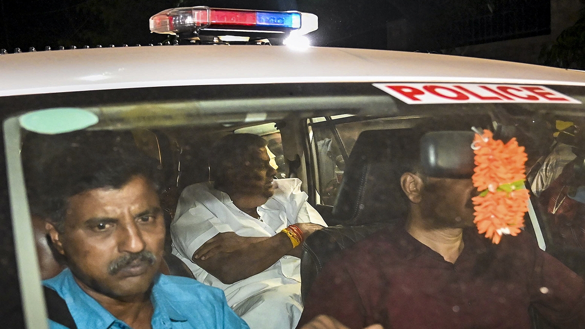 Karnataka JD(S) MLA H.D. Revanna being taken into custody by officials of a Special Investigation Team in a kidnapping case, on Saturday, May 4, 2024. (PTI Photo) Karnataka JD(S) MLA H.D. Revanna being taken into custody by officials of a Special Investigation Team in a kidnapping case, on Saturday, May 4, 2024. (PTI Photo)