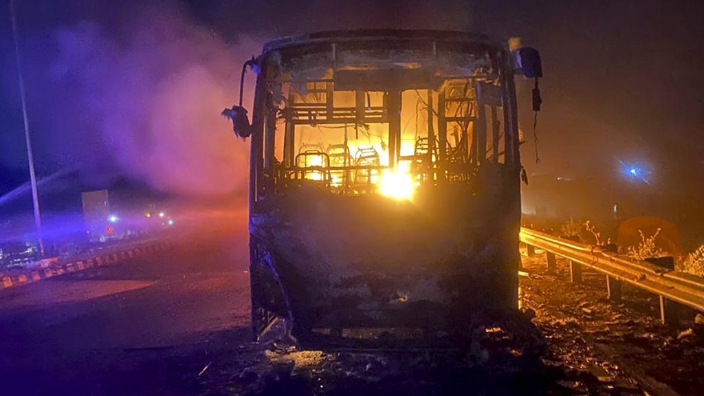 lames out after a bus caught fire that left at least eight dead and twenty others injured, near Tauru in Haryana's Nuh district, in the early hours of Saturday, May 18, 2024. (PTI Photo)