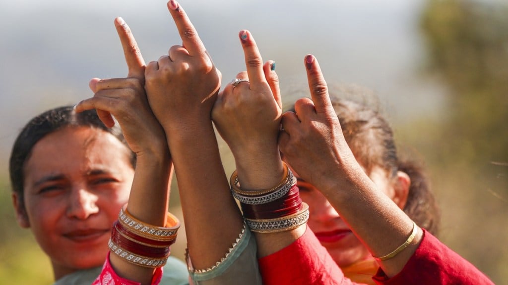 People show their inked fingers after casting their votes at Nowshera, in Rajouri district. (PTI Photo/File)