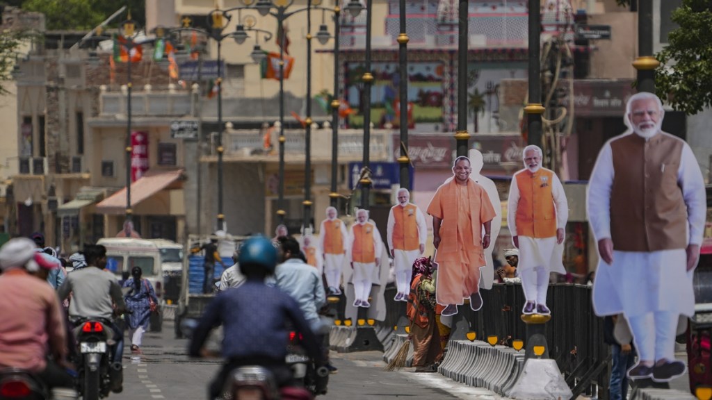Cutouts of Prime Minister Narendra Modi and Uttar Pradesh Chief Minister Yogi Adityanath are placed on a road ahead of PM Modi’s roadshow for the Lok Sabha elections, in Ayodhya, Sunday, May 5, 2024. (PTI Photo/Arun Sharma)