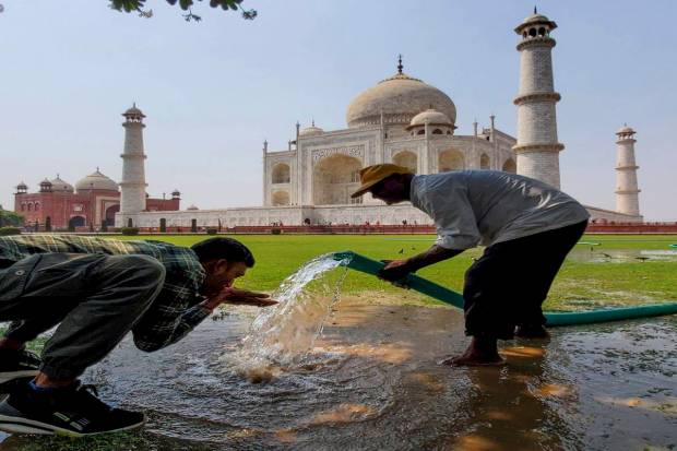 A person quenches his thirst on a hot summer day, in Agra. (PTI Photo)