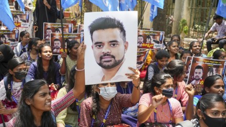 NSUI members hold a poster of JD(S) MP Prajwal Revanna during a protest against his involvement in the alleged sexual abuse case, in Bengaluru, Tuesday, April 30, 2024. (PTI Photo)