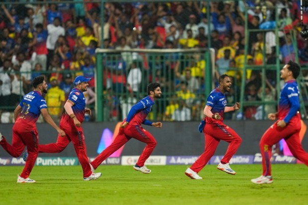 Royal Challengers Bengaluru players celebrate after winning their IPL 2024 match against Chennai Super Kings at M Chinnaswamy Stadium in Bengaluru. (PTI)