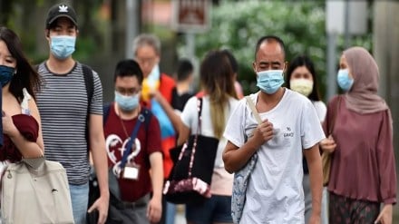 Singapore braces for COVID-19 surge with over 25,900 cases recorded in a week; govt urges citizens to wear masks.