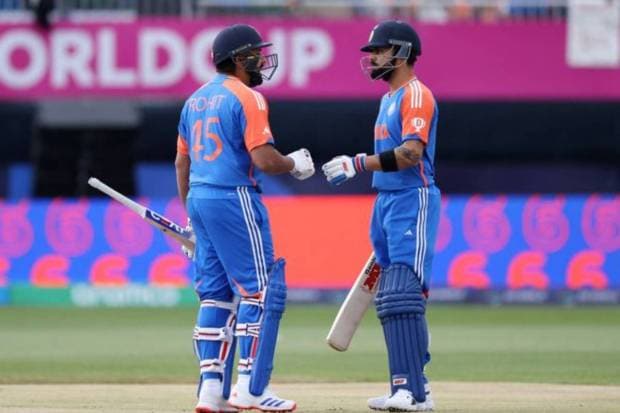 India's Rohit Sharma celebrates with Virat Kohli after hitting a six (REUTERS)