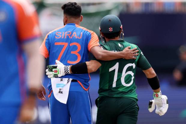 India's Mohammed Siraj with Pakistan's Mohammad Rizwan during the match. (REUTERS)