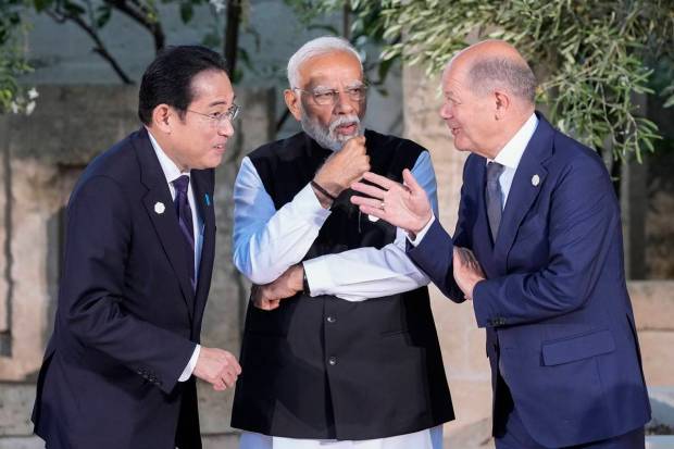 From left, Japan's Prime Minister Fumio Kishida, Indian Prime Minister Narendra Modi and German Chancellor Olaf Scholz talk as they stand for a family photo, at the G7 summit, Friday, June 14, 2024, in Borgo Egnazia, near Bari, southern Italy. AP/PTI