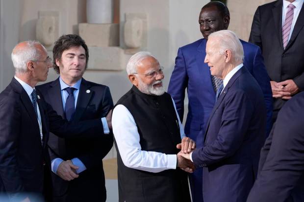 U.S. President Joe Biden shakes hands with Indian Prime Minister Narendra Modi while Argentina's President Javier Milei, second left, and Kenya President William Ruto, top right, look on, ahead of a family photo, at the G7 summit, Friday, June 14, 2024, in Borgo Egnazia, near Bari, southern Italy. AP/PTI