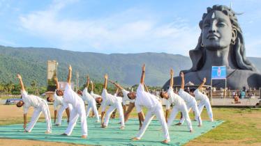 CISF personnel of Coimbatore Airport take part in a yoga session at Isha Foundation, a day before the International Day of Yoga, in Coimbatore. (PTI)