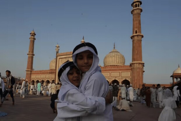 On the occasion of the 'Eid-ul-Adha', children at Jama Masjid in New Delhi greet one another after offering 'namaz'. (PTI)