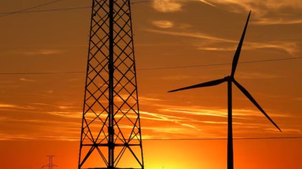 A wind turbine and electrical power pylons of high-tension electricity are pictured in a field near Sint-Pieters-Leeuw, Belgium A wind turbine and electrical power pylons of high-tension electricity are pictured in a field near Sint-Pieters-Leeuw, Belgium