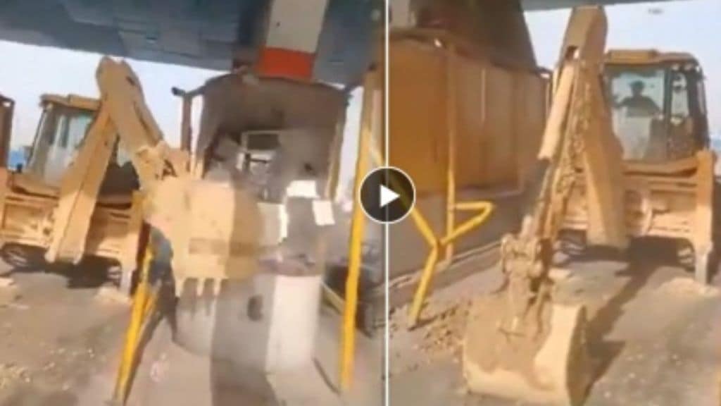 a bulldozer operator can be seen demolishing toll booths a bulldozer operator can be seen demolishing toll booths