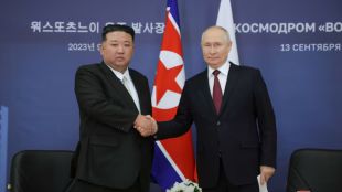 Russia's President Vladimir Putin and North Korea's leader Kim Jong Un attend a meeting