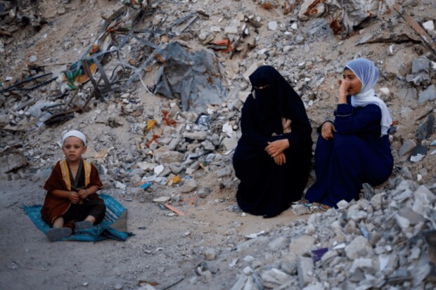 On June 16, 2024, in Khan Younis, in the southern Gaza Strip, Palestinians gather for Eid al-Adha prayers beside the remains of the al-Al Rahma mosque, which was devastated by Israeli airstrikes during the Israel-Hamas conflict. (Reuters)