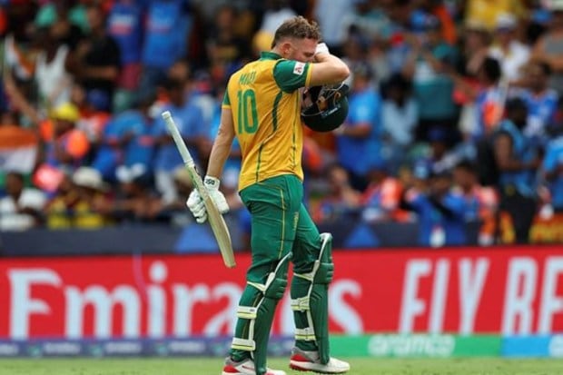 David Miller looks dejected as he walks off the pitch after being caught out by Yadav. (Reuters)