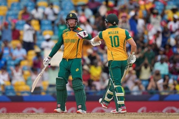 David Miller congratulates teammate Heinrich Klaasen for hitting a six. (AP/PTI)