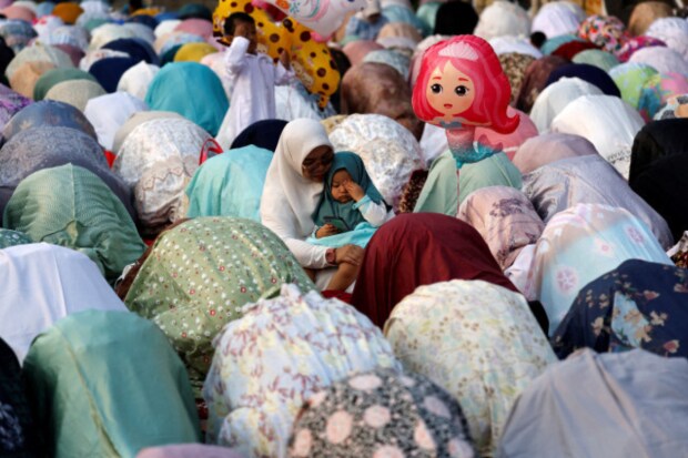 On June 17, 2024, during the Eid-ul-Adha celebrations in Jakarta, Indonesia, Indonesian women attended morning mass prayers. (Reuters)