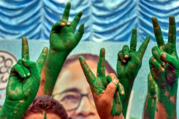 Murshidabad: TMC supporters flash victory signs covered in green 'gulaal' as they celebrate the party's lead during counting of votes for Lok Sabha elections, in Murshidabad district, Tuesday, June 4, 2024. (PTI Photo)