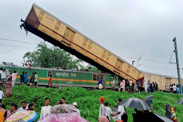Locals gather after the Kanchanjungha Express collided with a goods train, near New Jalpaiguri railway station, on Monday, June 17, 2024. (PTI Photo)
