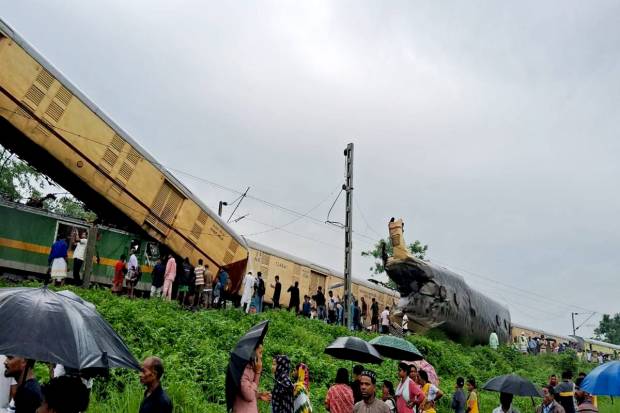 Locals gather after a collision between the Kanchanjungha Express and a goods train, near Rangapani railway station, on Monday, June 17, 2024. (PTI Photo)