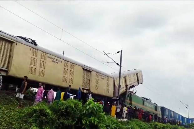 Locals gather after a collision between the Kanchanjungha Express and a goods train, near Rangapani railway station, on Monday, June 17, 2024. (PTI Photo)