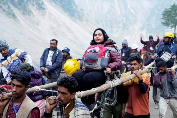 Pilgrims enroute to the holy cave shrine of Amarnath from the Baltal base camp during the annual Amarnath Yatra, in Ganderbal district. (PTI Photo)