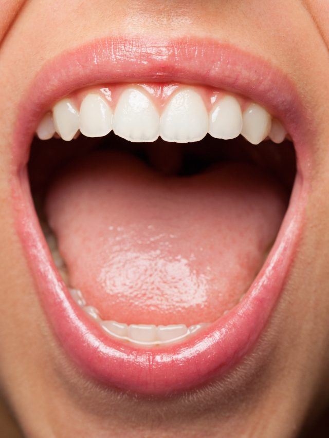 A young pretty woman teeth extreme closeup photo