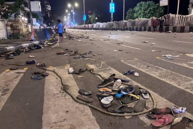 Footwears of public lying along a road near Marine Drive after the victory parade. (PTI)
