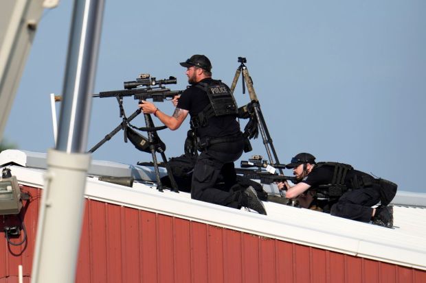 Police snipers return fire after shots were fired while Republican presidential candidate former President Donald Trump was speaking at a campaign event(Photo: AP/PTI)