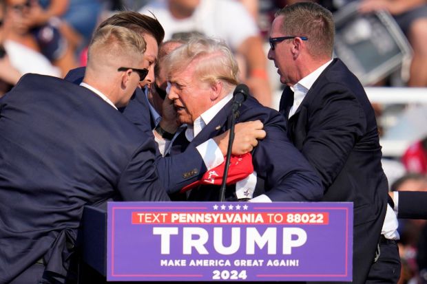 Republican presidential candidate former President Donald Trump is helped off the stage(Photo: AP/PTI)