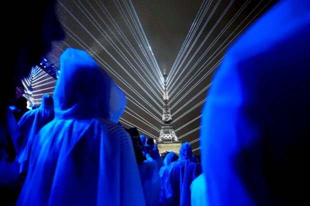 The Eiffel Tower is illuminated with lights (AP)