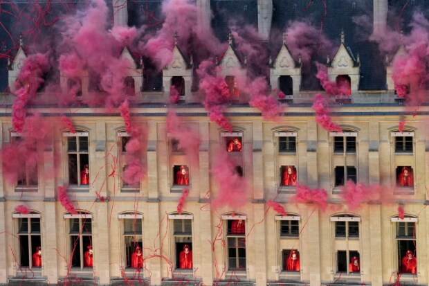 The ceremony featured scenes from the French Revolution. Smoke billows from the windows of the Conciergerie, where Marie Antoinette, the last French monarch before the revolution, was imprisoned (AP)