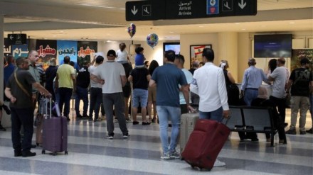 People stand at the Beirut Airport in Lebanon