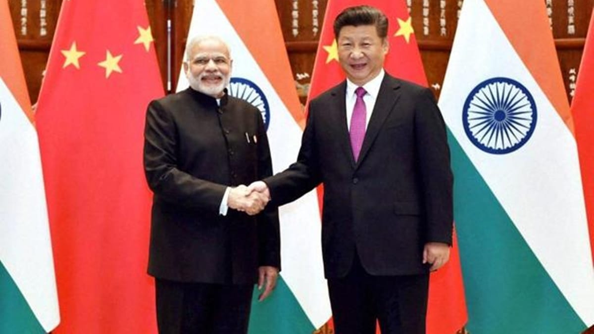Prime Minister Narendra Modi and Chinese President Xi Jinping pose for photographers as they shake hands before a bilateral meeting at Westlake State House in Hangzhou, China in 2016. (PTI)