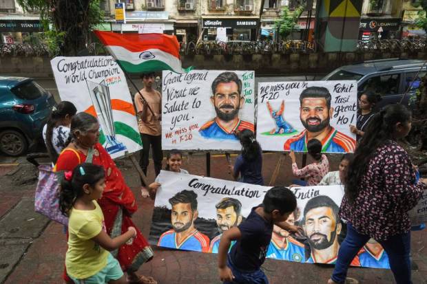 Hundreds of supporters, holding placards congratulating their favorite players and waving the national flag, braved the inclement weather to wait outside the airport for the victorious team. The team had defeated South Africa by seven runs in the final held in Bridgetown last Saturday. (PTI)