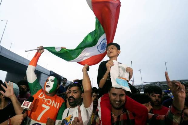 Fans gather to welcome the T20 World Cup-winning Indian cricket team at New Delhi airport. (PTI)