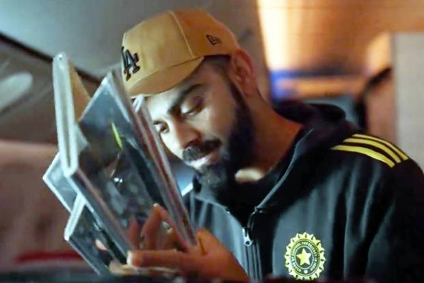 Rohit raised the coveted trophy for the fans to catch a glimpse before boarding the bus. Kohli, on his part, gave a thumbs up to acknowledge the support. (PTI)